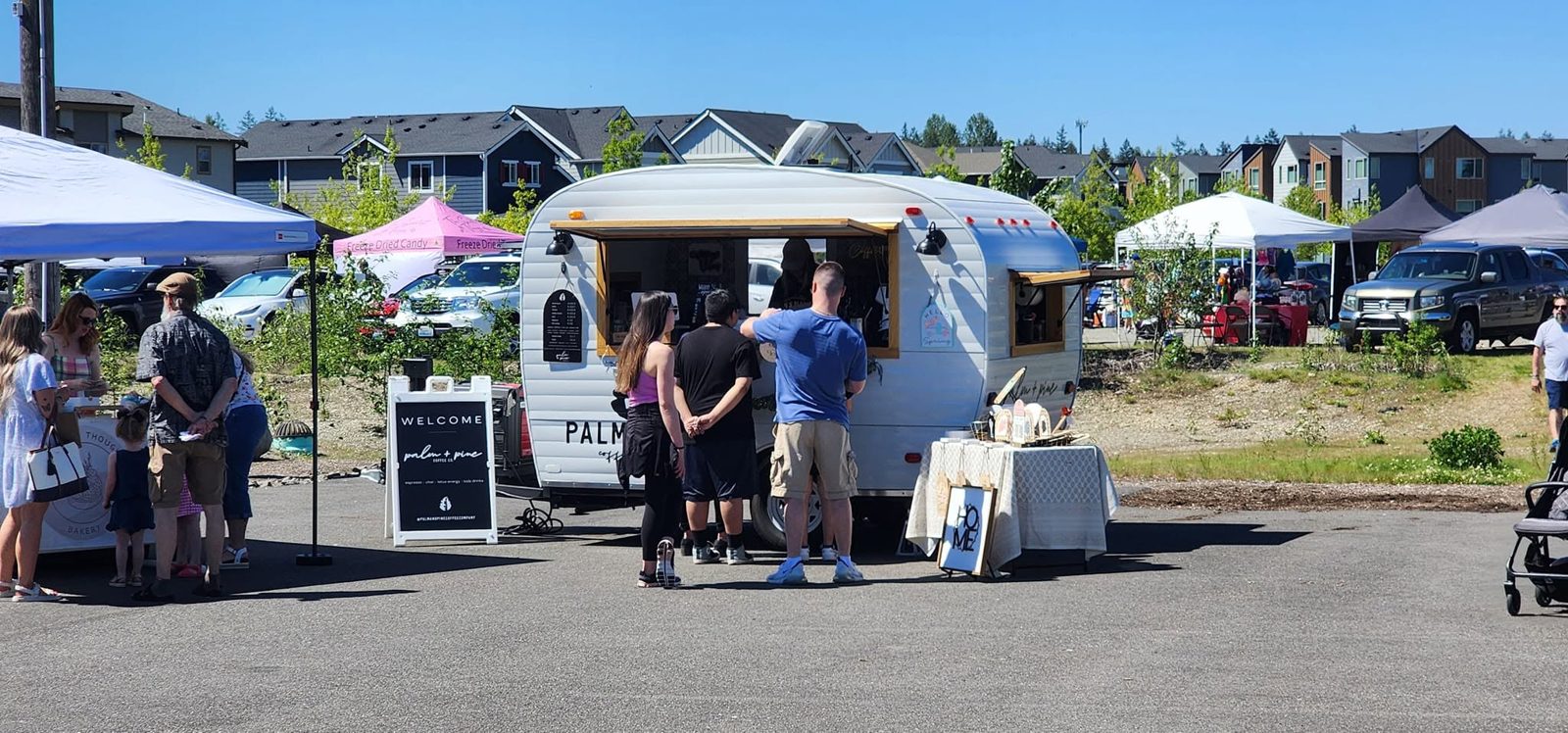 Guests gathering at the Palm + Pine Coffee trailer